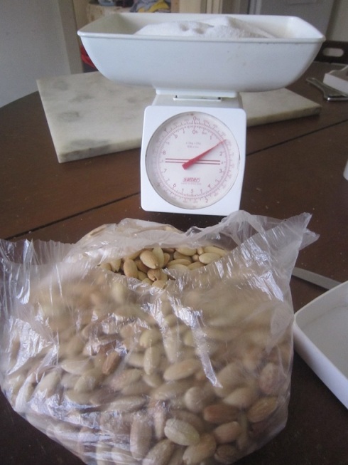 Weighing almonds and sugar